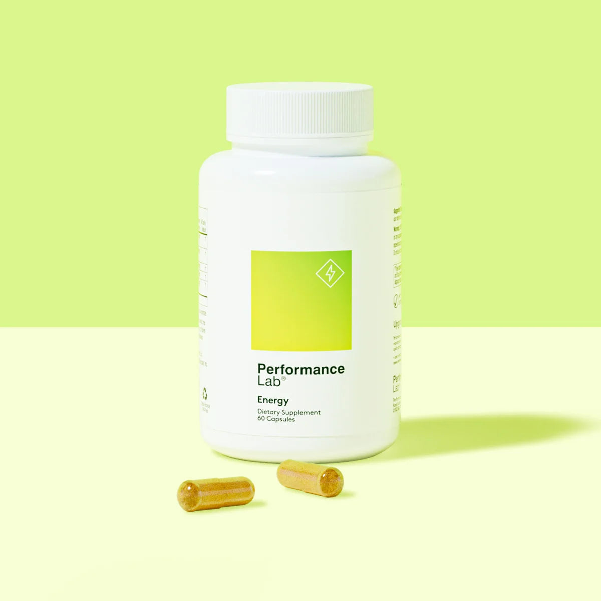 Performance Lab Energy supplement bottle with two capsules.