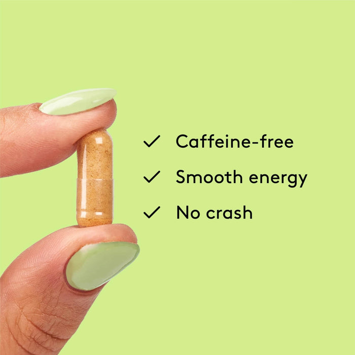 Energy capsule held between fingers highlighting features: Caffeine-free, Smooth energy, and No crash.