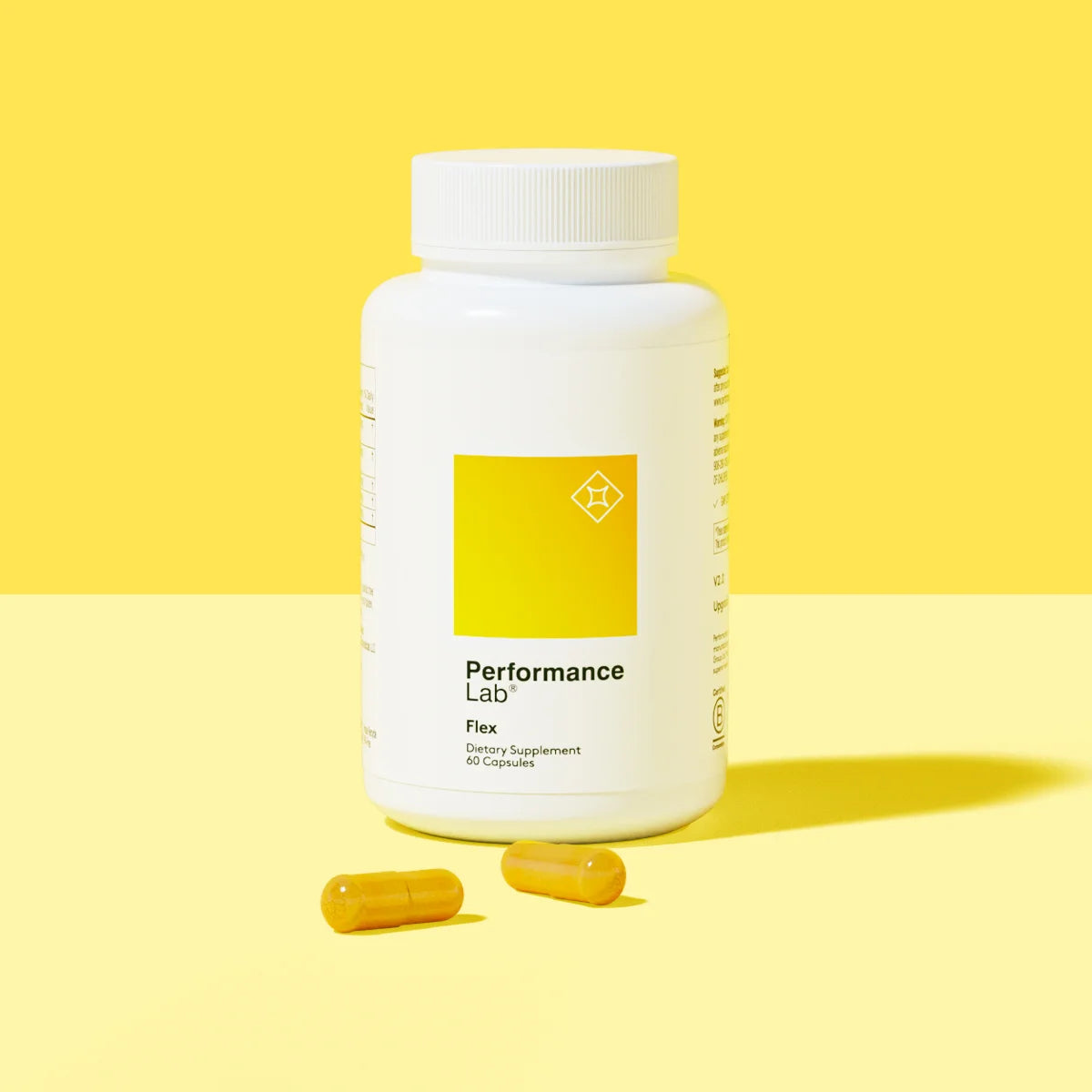 Performance Lab Flex supplement bottle with two capsules.
