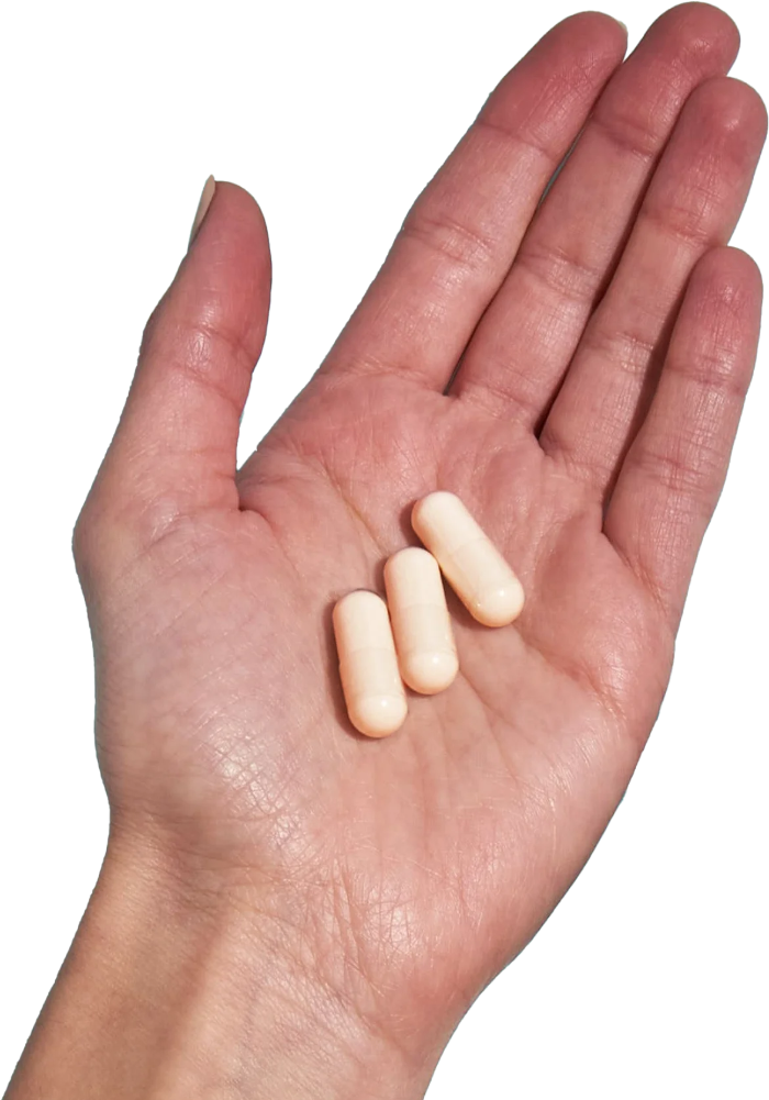 image of hand holding 3 Performance Lab® CA Magnesium capsules