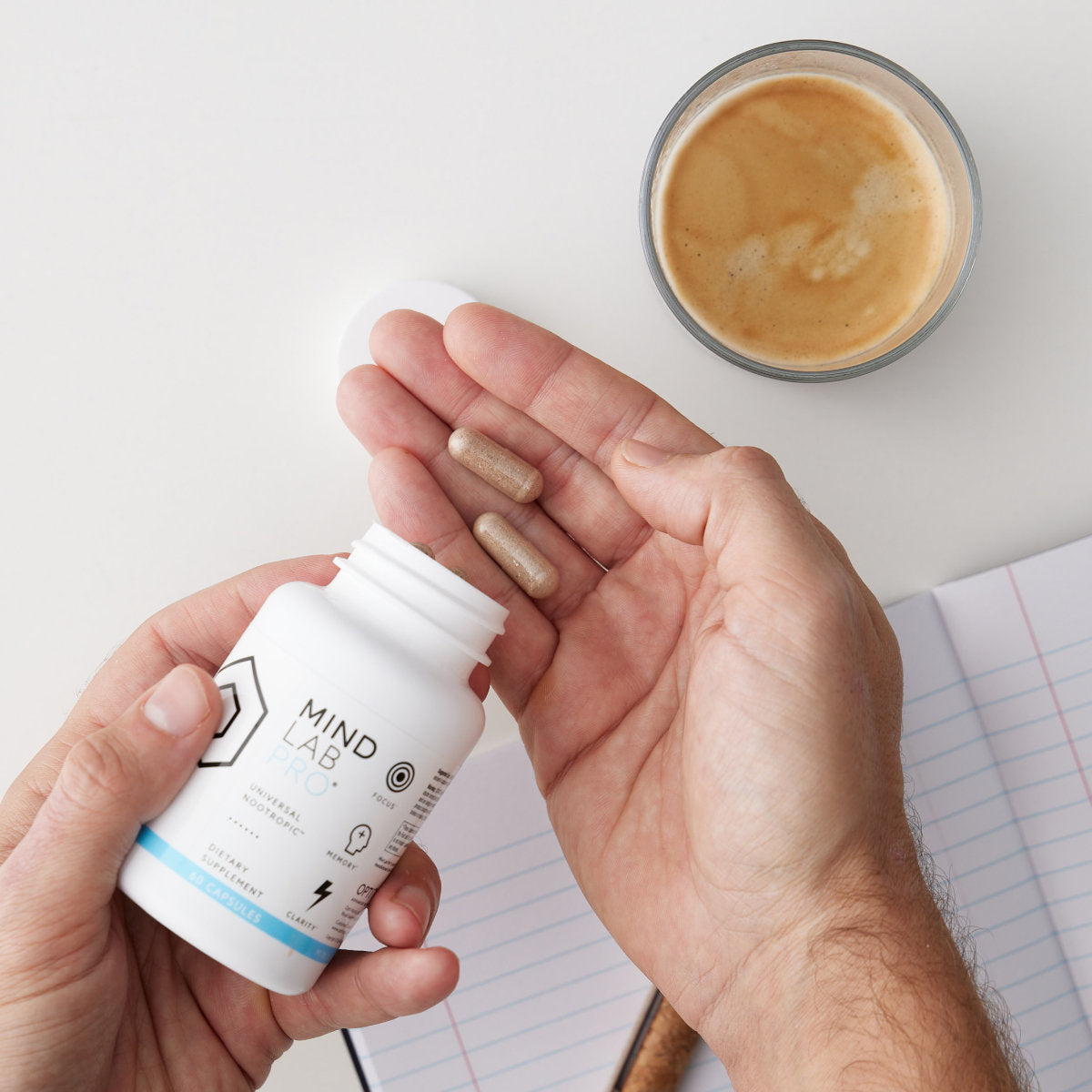 image of person holding Mind Lab Pro® capsules in hand