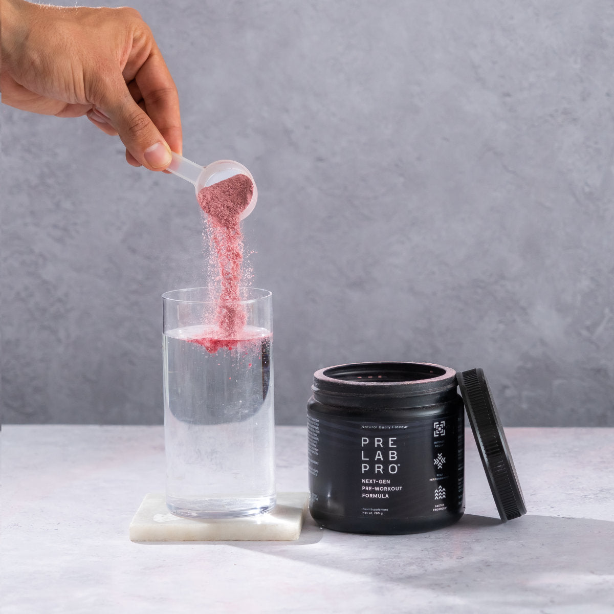 image of Pre Lab Pro® being added into a glass of water